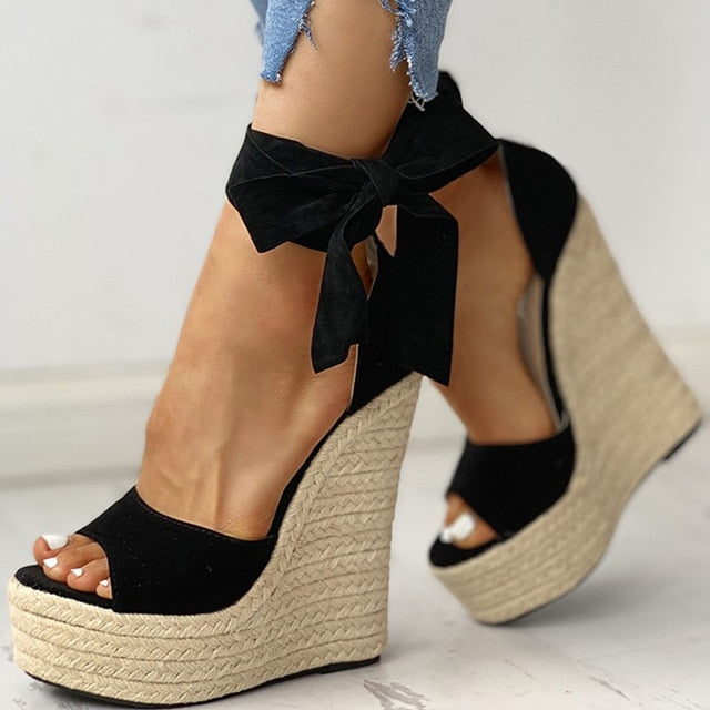 Platform heel sandals with floral patterns and woven details, perfect for summer